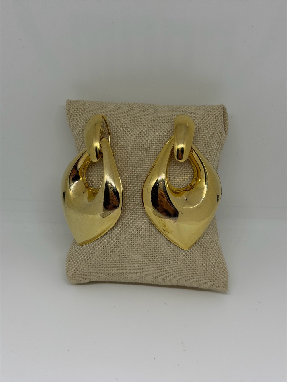 vintage gold-tone sculptural dangle or drop earrings featuring a bold, teardrop-
